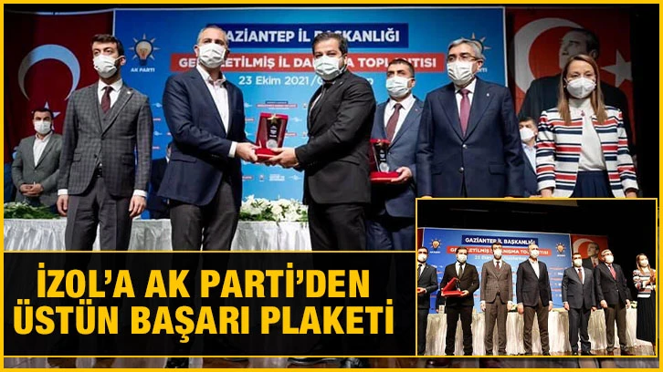 İzol’a AK Parti’den üstün başarı plaketi