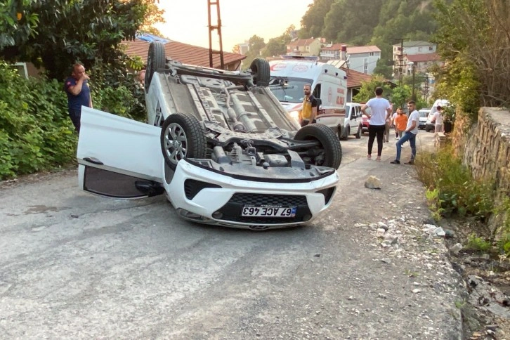 Takla atan araçtan yara almadan kurtuldular