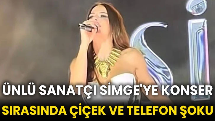 Ünlü sanatçı Simge'ye konser sırasında çiçek ve telefon şoku