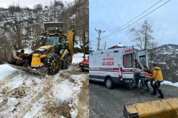 Kar nedeniyle yolu kapalı olan hasta iş makinesi ile ambulansa getirildi