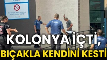 Kolonya içti, bıçakla kendini kesti